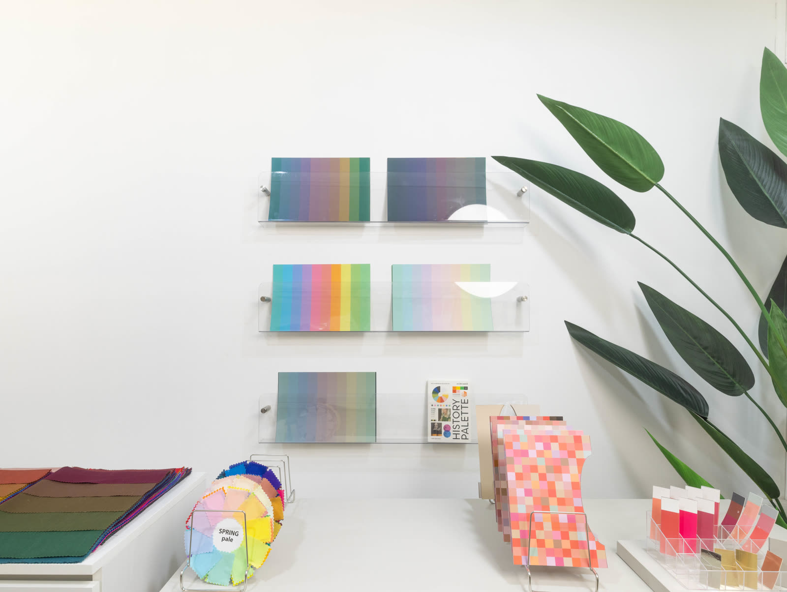 Color palette displays and seasonal swatch fans inside Soori Studio