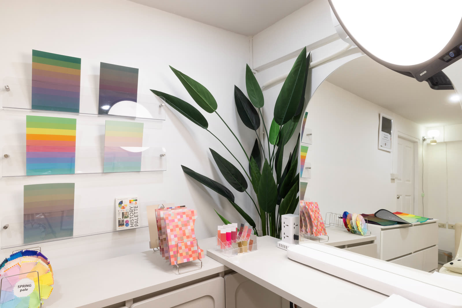 The Soori Studio color wall with palette boards and lip swatch display