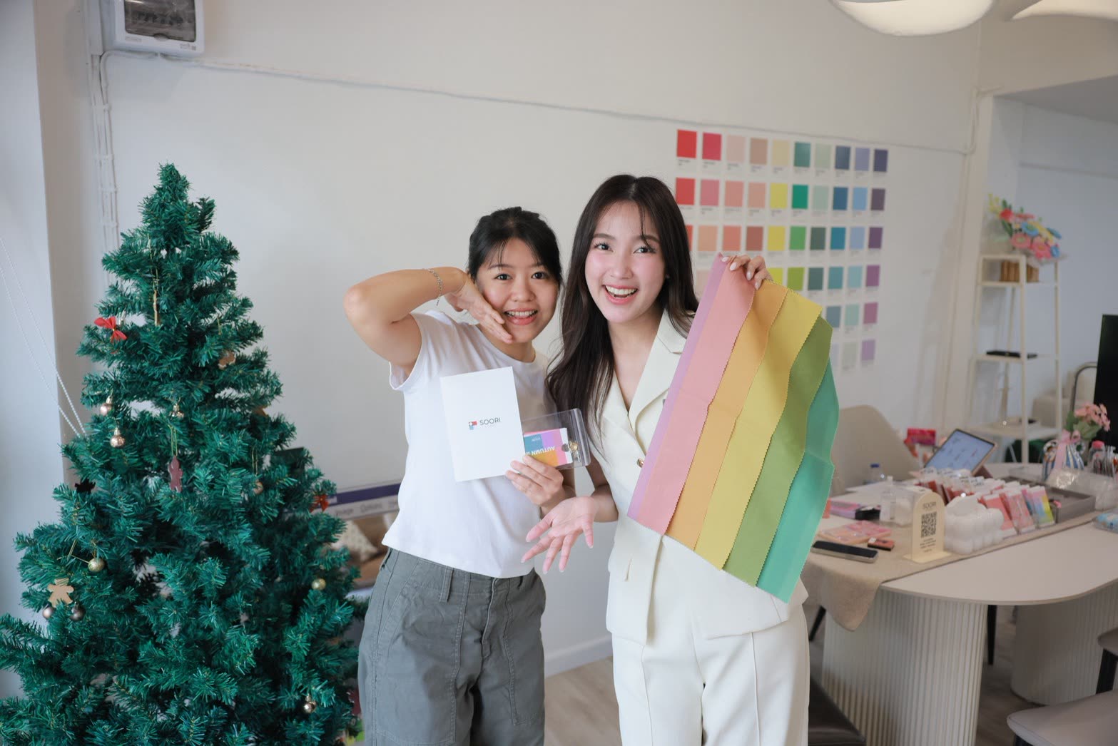 Happy clients with their color analysis result cards